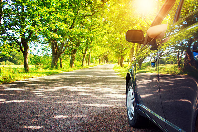 Image of car driving down road.