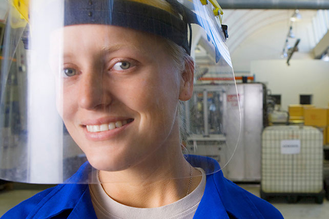 Image of factory worker with helmet on.