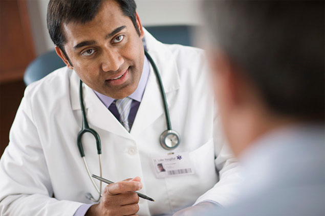 Image of doctor and patient talking.