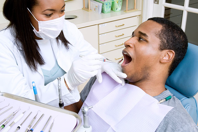 Image of dentist with patient.