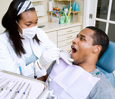 Image of dentist with patient.