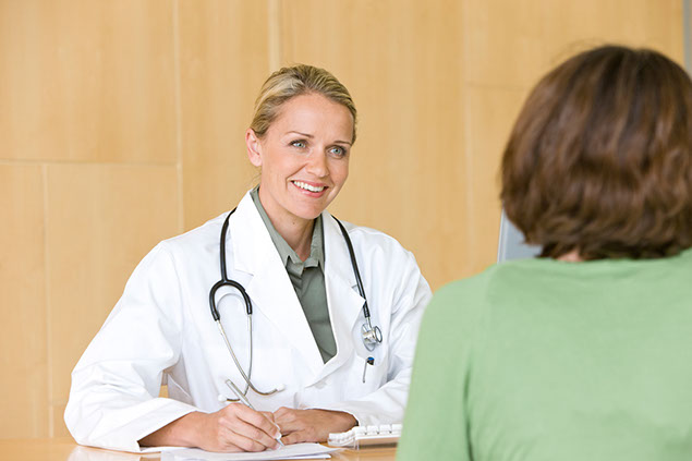 Image of doctor and patient talking.