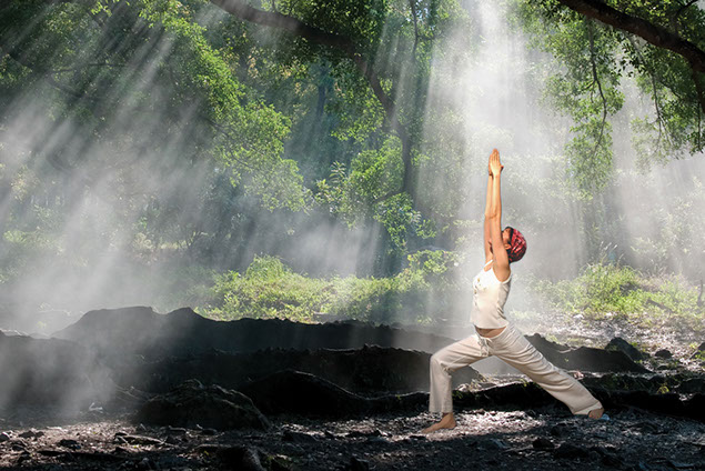 Image of person in nature doing yoga.