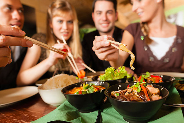 Image of friends eating out.