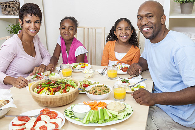 Image of family eating together.