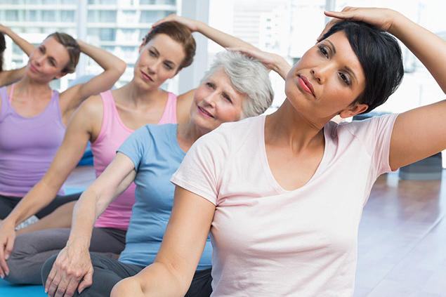 Image of a class doing stretching exercises.
