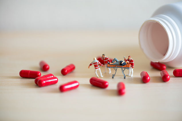 Image of pills and toy medics.