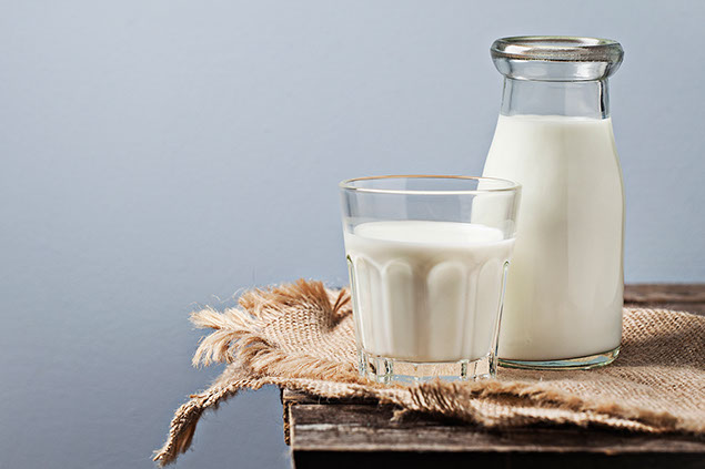 Image of glass and jar of milk.