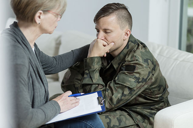 Image of Veteran getting help from a counselor.