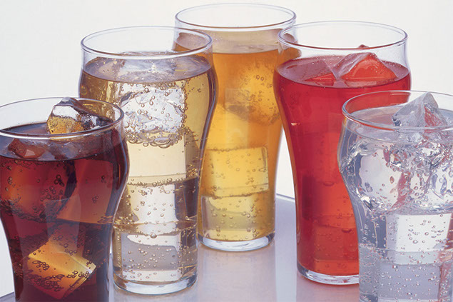 Image of 5 glasses filled with soda.