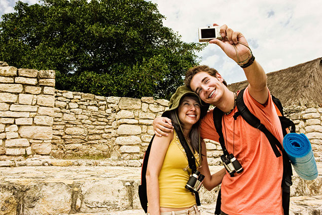 Image of couple taking a selfie on vacation.