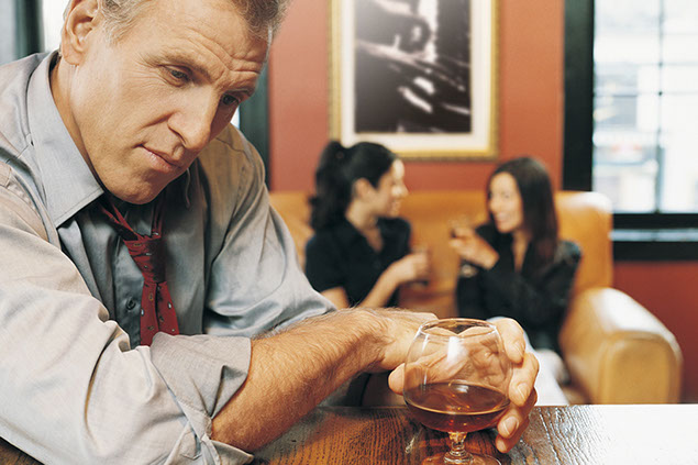 Image of man drinking alone.