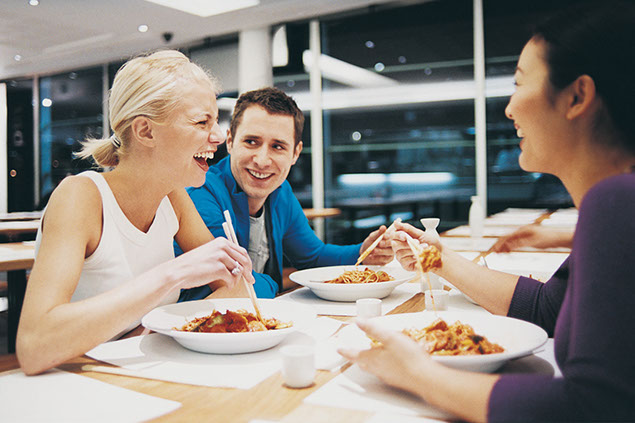 Image of friends eating out.
