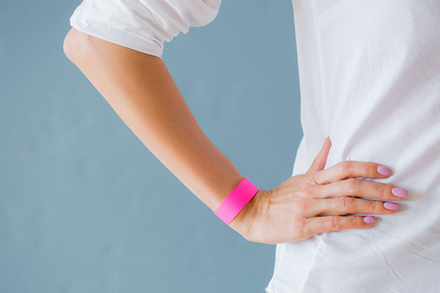 Women wearing a rubber band around wrist.