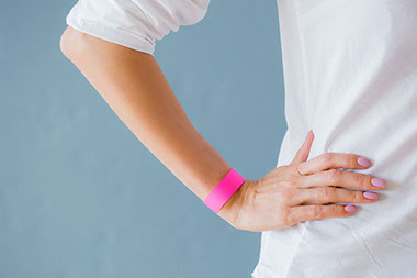 Women wearing a rubber band around wrist.