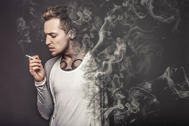 Man smoking, while half his body in vanishing into smoke.