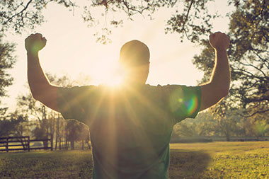 Man with arms up.