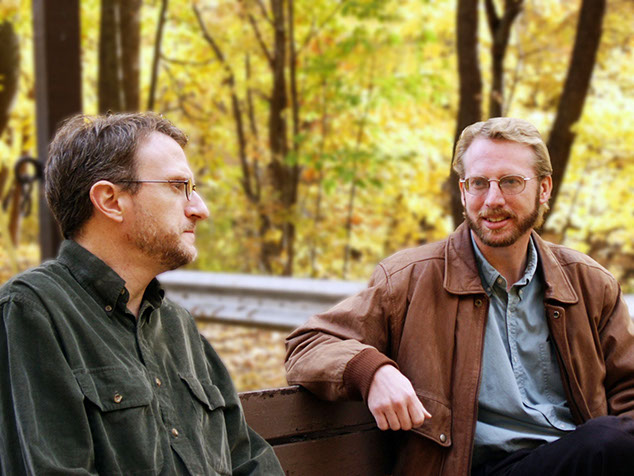 Image of two friends talking.