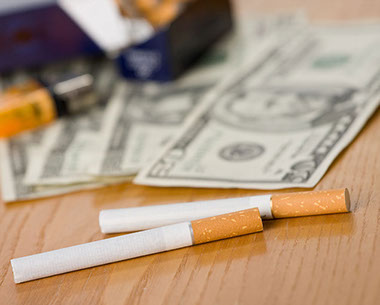 Image of cigarettes and money.