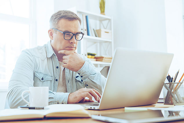 Man on computer.