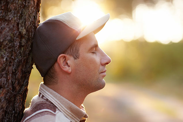 Image of man with his eyes closed.