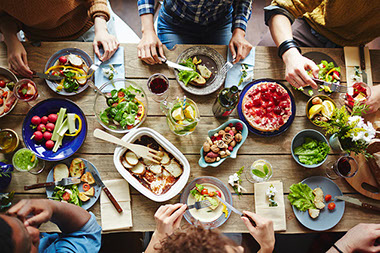 Top view of friends eating together.