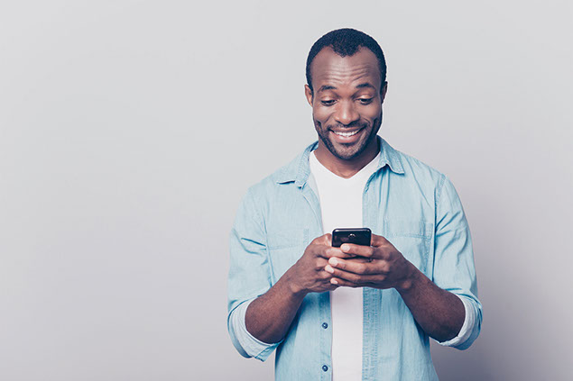 Man typing on his phone.