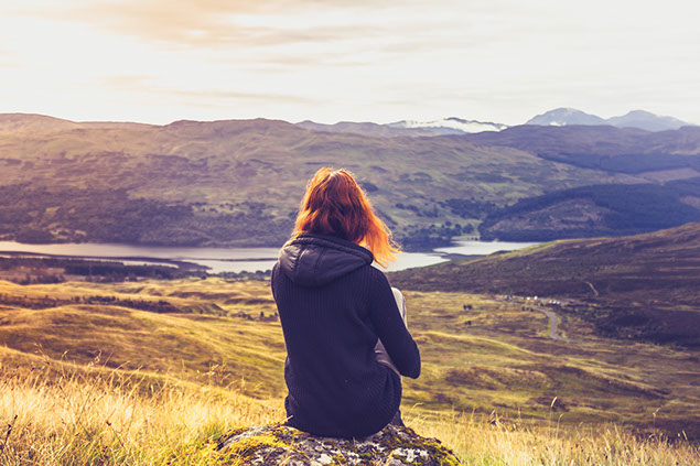 Image of women sitting out in nature.