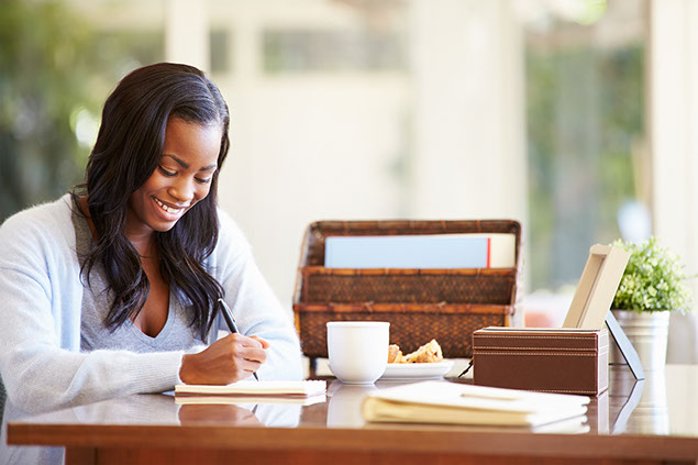 Image of women writing.