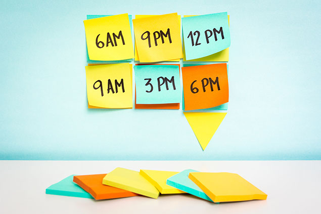 Image of sticky notes with times on them.