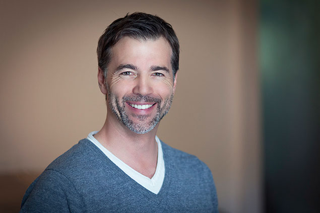 Image of man smiling.